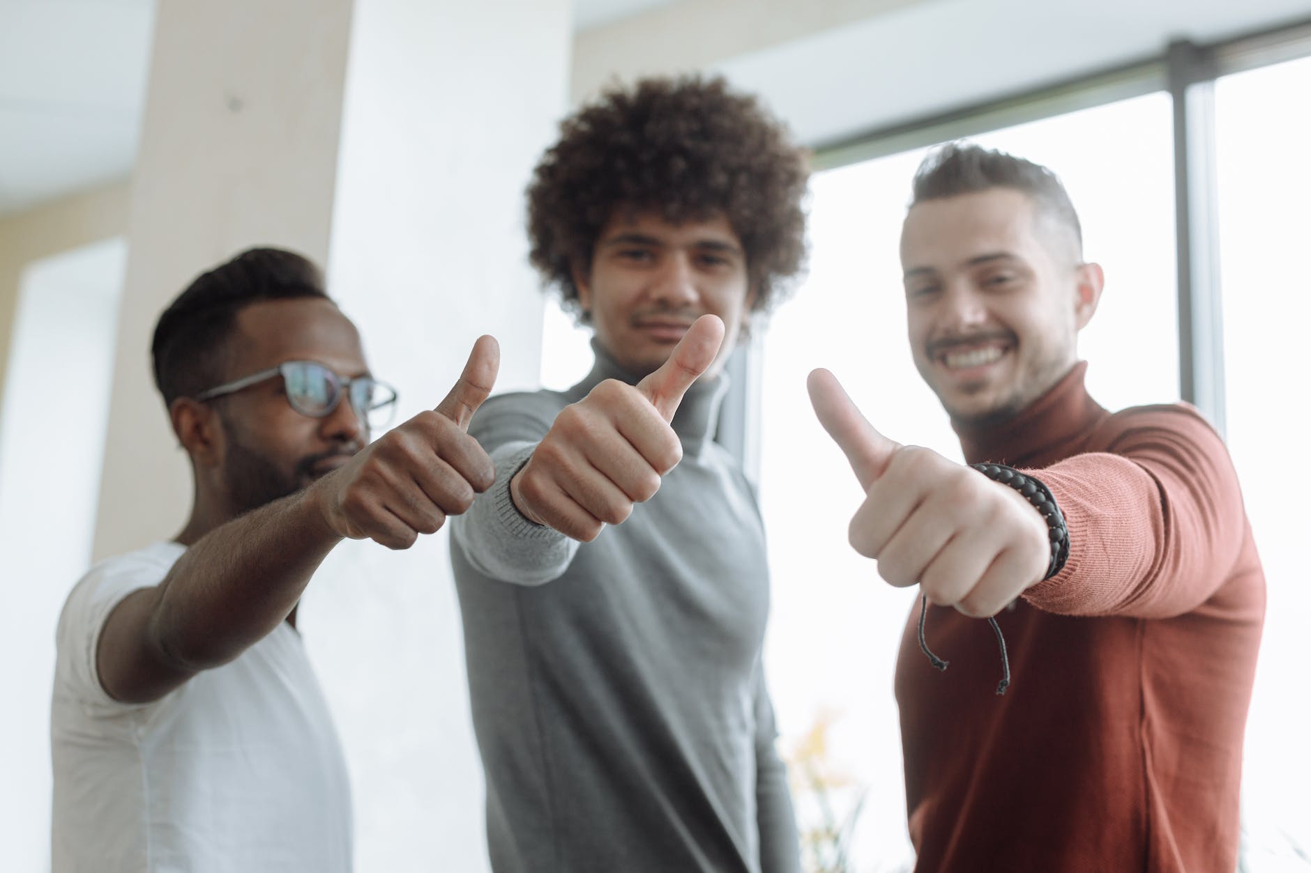 men putting a thumbs up