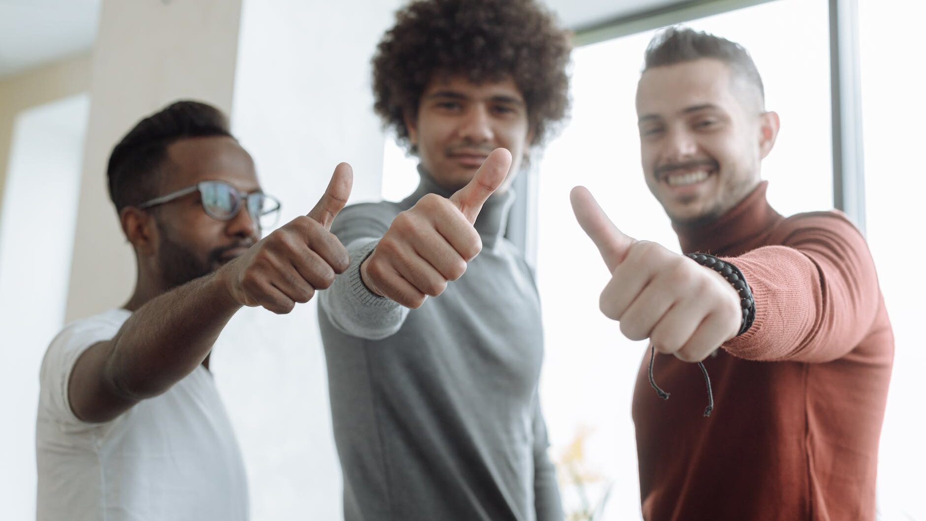 men putting a thumbs up