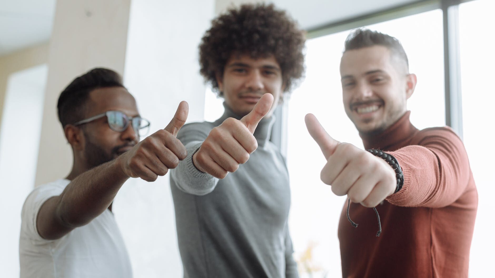 men putting a thumbs up